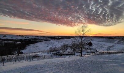 Fototapeta na wymiar Sunset, clouds, snow