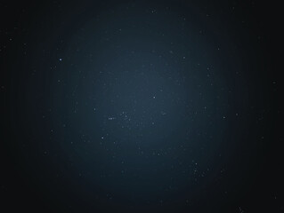 A dark, starry night sky. Numerous stars of varying brightness are scattered across the image, creating a serene and cosmic atmosphere. 