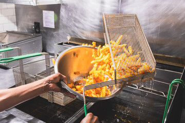 fries coming out of frier basket