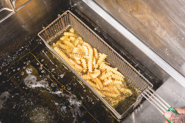 fries coming out of fryer