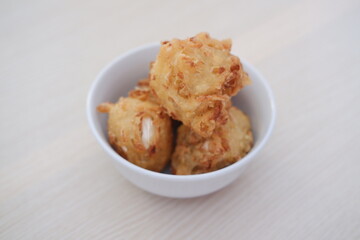 Bakwan sayur or vegetable fritter, Indonesian snack made from flour, cabbage, carrots and bean sprouts, served with chili