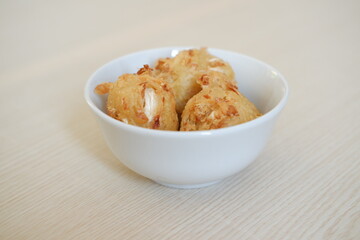 Bakwan sayur or vegetable fritter, Indonesian snack made from flour, cabbage, carrots and bean sprouts, served with chili