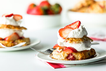 Individual servings of fresh strawberry shortcake, ready for eating.