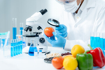 Scientist check chemical food residues in laboratory. Control experts inspect quality of fruits,...
