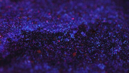 Sparkling fluid flow. Bokeh light. Defocused neon purple pink black color shimmering glitter texture gel ink wave motion abstract art background.