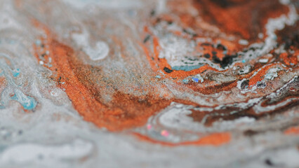 Marble ink. Paint blend splash. Defocused brown orange white black color sparkling emulsion mix flow motion abstract art background. © Photodrive