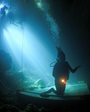A Female Teen Scuba Diver Swims and Trains  at the Devil's Den Cave In Florida