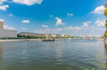 Naklejka premium Cruise ship sails on the Moscow river in Moscow city center, popular place for walking.