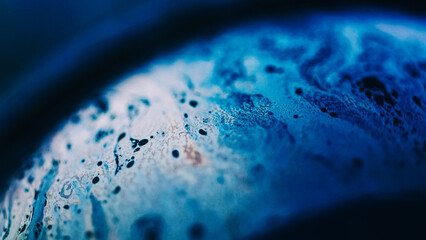 Bubble fluid. Oil liquid texture. Paint water. Defocused blue color glowing ink wave motion sphere...