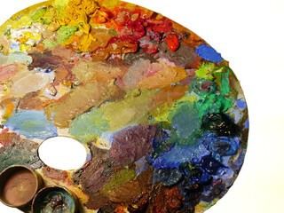 Colorful artist palette full of acrylic paint.
