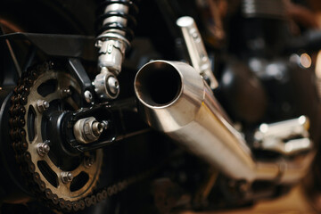 Closeup image of motorcycle exhaust pipe