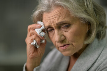 Close up portrait of sick senior woman