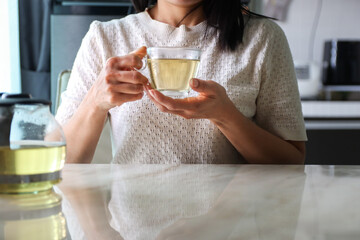 asian women drinking Hot tea In morning for good healthy