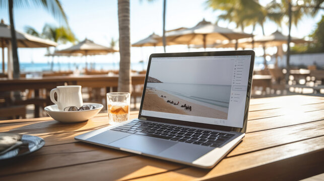 Man typing on a portable keyboard at a beachside cafe, enjoying the benefits of remote work © basketman23