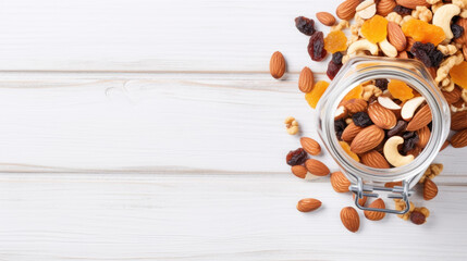 Glass jar filled with mix of nuts and raisins. Perfect for healthy snacking or adding to recipes