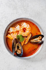seafood soup on the stone background