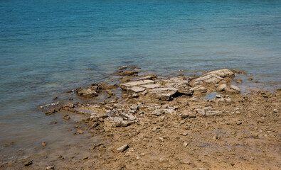 Rocks in the blue sea area