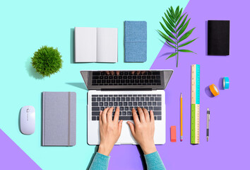 Person using a laptop computer from above