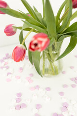 Background for Valentine's Day. Assorted pink, purple, white heart shaped candies with printed messages of love. Messages about kisses. Gift for Women's Day, March 8