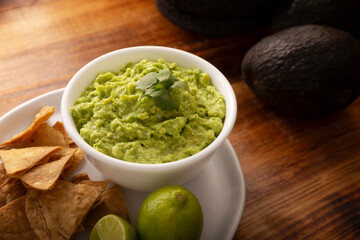 Guacamole. Avocado dip sauce,  one of its many ways of consuming it is spread on tortilla chips also called Nachos. Mexican easy homemade sauce recipe very popular.