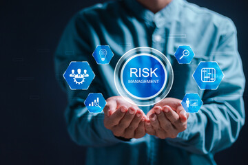 Risk management concept. Businessman with virtual screen of Risk analysis in business decisions....