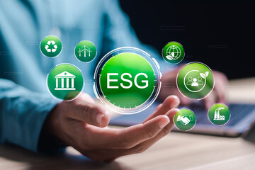 ESG environmental, social and governance. Businessman use laptop with virtual ESG icons for world sustainable environment concept. social business strategy, environment, business investment strategy.