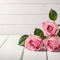 Flowers of pink roses on white wood background. Happy Valentine's Day with this romantic greeting card.