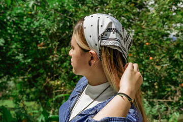 Latin woman planting in the garden in spring