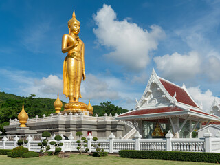 Golden standing Buddha in Hat Yai, Thailand