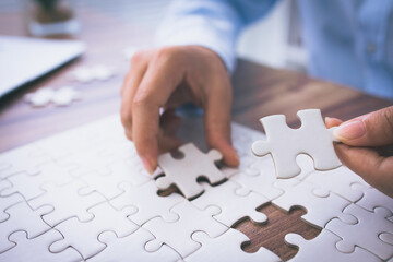  Hand of woman connecting jigsaw puzzle, Business solutions, success and strategy, Business...
