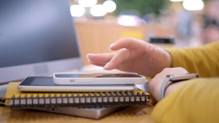 Young woman using smartphone at mall. Caucasian girl looking at mobile phone. Communication, work or study, connection, mobile apps, technology, lifestyle concept 4K - Powered by Adobe