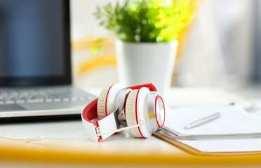 Empty remote office workplace with laptop pc and headset closeup. Receptionist or secretary of...
