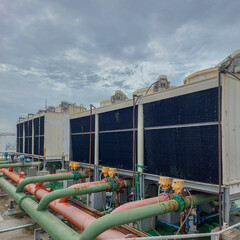 Sets of cooling towers in data center building.