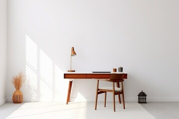 a minimalist home office setup with a wooden desk and chair against a white wall. The desk has a lamp and a cup of coffee on it. A plant and a lantern are on the floor next to the desk.