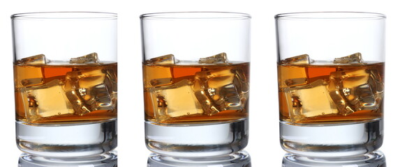 Whiskey with ice in a glass isolated on a white background