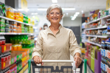 Caucasian elderly woman  while purchasing household products in supermarket. Senior female with...