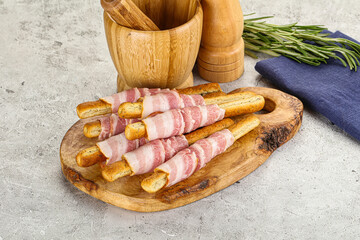 Crispy grissini italian bread with bacon