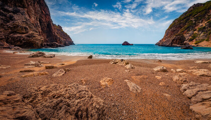 Empty spring view of Gyali beach. Rocky morning seascape of Ionian Sea. Stunning outdoor scene of...