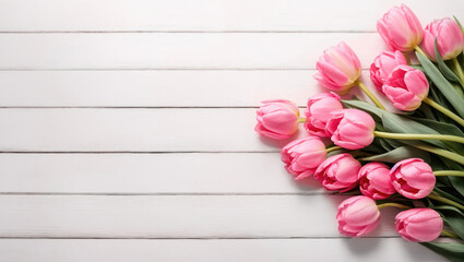 Pink tulips on white wooden background. Copy space