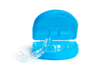 Vivid blue box with invisible braces on white background, dental orthodontic transparent health equipment