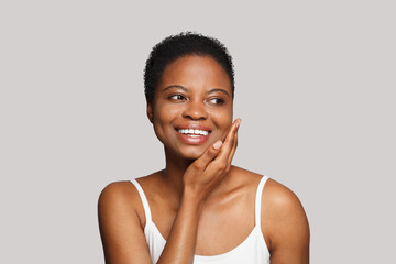 Beautiful female face and moisturizing anti-aging cream. Aging skin care, moisturizing and facial...
