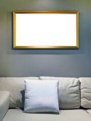 Interior mockup blank cutout transparent picture frame in horizontal hanging on wall with decor bright interior, colorful sofa and backrest pillow or scatter cushion