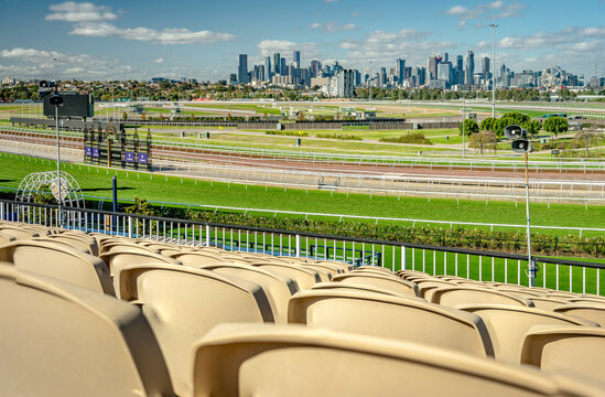 Melbourne, Australia - May 25, 2020: Flemington racecourse with city skyline in the background as seen from a spectator seat