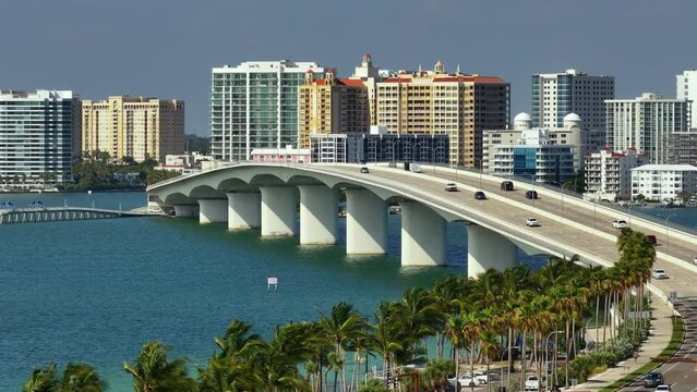 Urban travel destination in the USA. Sarasota city downtown with Ringling Bridge and expensive waterfront high-rise buildings in Florida. Urban travel destination in the USA.