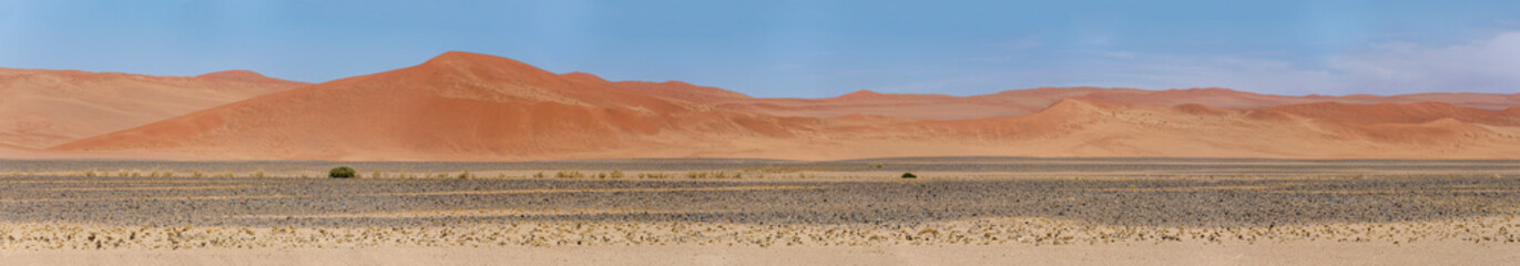 Fototapeta na wymiar smooth slopes and shades of red on big dunes at Naukluft desert, near Sossusvlei, Namibia