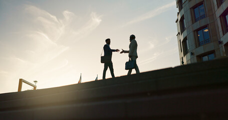 Business people, handshake and city silhouette for partnership, outdoor introduction and travel...