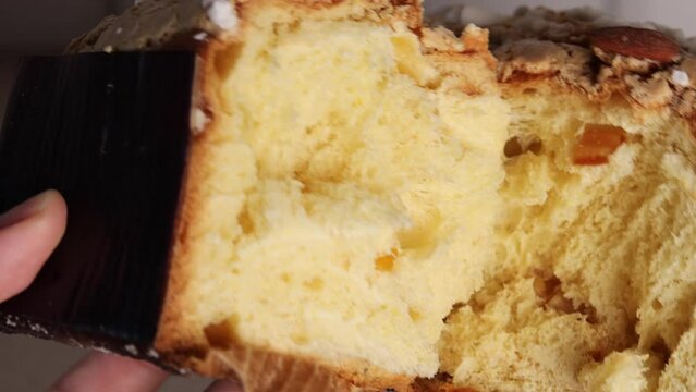 show the pulp of the Colomba Pasquale, a traditional Italian Easter cake shaped like a pigeon. This Easter bread, known as Colomba, is studded with nuts.