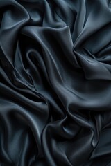 Close up shot of black silk fabric. Can be used for fashion design or textile backgrounds