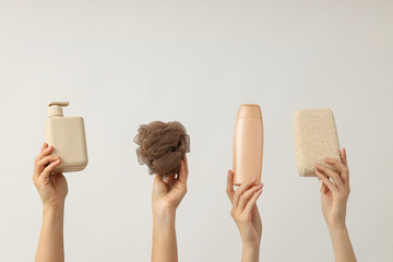 Hygiene products in the hands of women, on a bright background. - obrazy, fototapety, plakaty