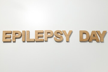 Epilepsy day written in wooden letters on a white background